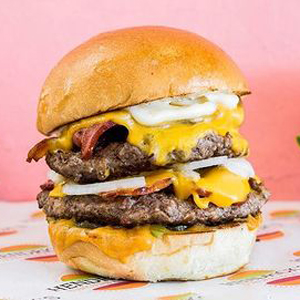 Mr Brightside signature burger with beef patty, cheese, and Hendrick's sauce